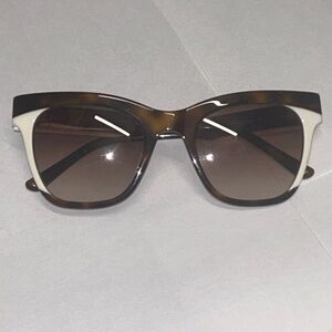 Gwen Stefani L.A.M.B. 
Stylish Tortoise Shell Sunglasses